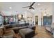 Open-concept living room and dining room with hardwood floors and ample natural light at 21131 E Excelsior Ave, Queen Creek, AZ 85142