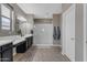 This bathroom boasts dual sinks, a glass enclosed shower, and decorative hand towels at 2148 W Angelo Way, San Tan Valley, AZ 85144