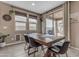 Inviting dining area with a wooden table, sliding glass door access to a patio, and natural light at 2148 W Angelo Way, San Tan Valley, AZ 85144