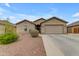 Beautiful home with a two-car garage, desert landscaping, and modern design elements at 2148 W Angelo Way, San Tan Valley, AZ 85144