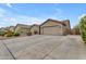 Charming single-story home featuring a two-car garage and well-manicured front yard at 2148 W Angelo Way, San Tan Valley, AZ 85144