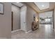 Stylish foyer showcasing tile floors, a console table, and an open view to the living area at 2148 W Angelo Way, San Tan Valley, AZ 85144