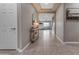 Elegant foyer leading into an open living space with tile flooring and neutral decor at 2148 W Angelo Way, San Tan Valley, AZ 85144