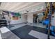 Spacious three car garage with epoxy floors, custom lighting and organization at 2148 W Angelo Way, San Tan Valley, AZ 85144