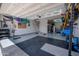Spacious three car garage with epoxy floors, custom lighting and organization at 2148 W Angelo Way, San Tan Valley, AZ 85144