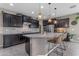 Well-appointed kitchen featuring granite countertops, stainless steel appliances, and a functional island at 2148 W Angelo Way, San Tan Valley, AZ 85144