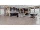 Bright kitchen with dark cabinets, stainless steel appliances, and a large island with seating at 2148 W Angelo Way, San Tan Valley, AZ 85144