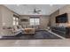 Comfortable living room showcasing a large sectional sofa, modern decor, and abundant natural light at 2148 W Angelo Way, San Tan Valley, AZ 85144