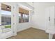 Bright dinette next to door to backyard patio with fenced pool area and view to the kitchen at 21539 N 72Nd Pl, Scottsdale, AZ 85255