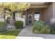 Inviting front entrance with a decorative security door and meticulously maintained landscaping at 21539 N 72Nd Pl, Scottsdale, AZ 85255