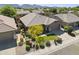 Aerial view showcases this charming property with green lawn and landscaping, set in a peaceful neighborhood at 21539 N 72Nd Pl, Scottsdale, AZ 85255