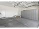 Spacious garage with ample storage provided by a full wall of gray storage lockers at 21539 N 72Nd Pl, Scottsdale, AZ 85255