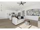 Contemporary living room with an open floor plan, leading into a modern, well-equipped kitchen at 21539 N 72Nd Pl, Scottsdale, AZ 85255