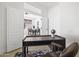 Bright home office featuring a modern desk and adjacent dining area with natural light at 21539 N 72Nd Pl, Scottsdale, AZ 85255