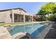 Inviting pool area with stone accents, lush landscaping, and space for outdoor entertaining at 21539 N 72Nd Pl, Scottsdale, AZ 85255