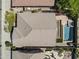 Aerial view of a private backyard oasis with a sparkling pool, patio area, and lush greenery at 21539 N 72Nd Pl, Scottsdale, AZ 85255