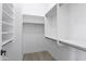 This spacious walk-in closet offers ample storage with built-in shelving and hanging rods at 21539 N 72Nd Pl, Scottsdale, AZ 85255