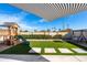 Backyard features a playground, artificial grass and shade structure at 2313 N 66Th St, Scottsdale, AZ 85257