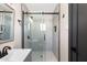 Modern bathroom features a glass shower, mirror, and tiled wall at 2313 N 66Th St, Scottsdale, AZ 85257