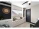 Charming bedroom featuring a window seat, built-in shelves, neutral walls, and a stylish dark door at 2313 N 66Th St, Scottsdale, AZ 85257