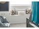 Cozy bedroom nook with an abundance of pillows, ideal for relaxation and unwinding after a long day at 2313 N 66Th St, Scottsdale, AZ 85257