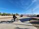 Person enjoys the community with bicycle on a paved pathway at 2313 N 66Th St, Scottsdale, AZ 85257