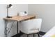 Bright office desk with an adjacent lamp and chair, creating an ideal workspace for productivity and comfort at 2313 N 66Th St, Scottsdale, AZ 85257
