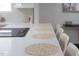 Eat-in kitchen features a white countertops and seating at the island at 2313 N 66Th St, Scottsdale, AZ 85257