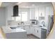 Bright and modern kitchen features white cabinets, stainless steel appliances, and ample counter space at 2313 N 66Th St, Scottsdale, AZ 85257