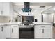 Open kitchen overlooking the living room, featuring sleek appliances and modern finishes at 2313 N 66Th St, Scottsdale, AZ 85257