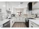 Beautiful kitchen featuring white cabinets, stainless appliances, modern backsplash, and ample counter space at 2313 N 66Th St, Scottsdale, AZ 85257