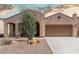 Charming single-story home featuring desert landscaping and a welcoming covered porch at 27418 W Mohawk Ln, Buckeye, AZ 85396