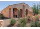 Single-story stucco home with desert landscaping and covered front porch at 27418 W Mohawk Ln, Buckeye, AZ 85396
