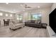 Inviting living room featuring abundant natural light and views of the outdoor landscape at 27418 W Mohawk Ln, Buckeye, AZ 85396