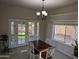 Cozy dining room with a table and chairs, complemented by natural light from the window and patio doors at 2955 E Hermosa Vista Dr, Mesa, AZ 85213
