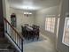 Bright dining room showcasing a large table, 8 chairs, tile floor and natural light from the window at 2955 E Hermosa Vista Dr, Mesa, AZ 85213