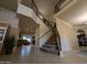 Expansive foyer featuring high ceilings, a staircase, and views into the living room and kitchen at 2955 E Hermosa Vista Dr, Mesa, AZ 85213