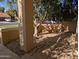 Inviting front porch with stone flooring, lush landscaping, and shaded seating area offers a relaxing outdoor space at 2955 E Hermosa Vista Dr, Mesa, AZ 85213