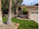 Lush green grass and landscaped flower beds lead up to this charming home at 2955 E Hermosa Vista Dr, Mesa, AZ 85213