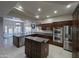 Spacious kitchen with stainless steel appliances, a kitchen island and a view to the backyard at 2955 E Hermosa Vista Dr, Mesa, AZ 85213