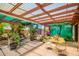 Backyard featuring a shaded patio and decorative plants at 3247 E Sheridan St, Phoenix, AZ 85008