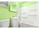 Bright bathroom featuring a tub with shower, vanity sink, and toilet at 3247 E Sheridan St, Phoenix, AZ 85008