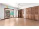 Bedroom with hardwood floors and a door that leads to the backyard at 3247 E Sheridan St, Phoenix, AZ 85008
