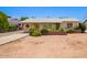 Charming single-story home with desert landscaping, a quaint front yard, and a welcoming entrance at 3247 E Sheridan St, Phoenix, AZ 85008