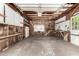 Spacious garage featuring storage shelves and unfinished details at 3247 E Sheridan St, Phoenix, AZ 85008