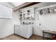 Laundry room featuring washer, dryer, shelves, and a table at 3247 E Sheridan St, Phoenix, AZ 85008