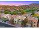 Beautiful home with a two-car garage and desert landscaping in a golf course community, set against mountain views at 3277 E Meadowview Dr, Gilbert, AZ 85298