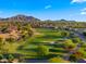 Aerial shot showcases the golf course community with mountain views and well-maintained landscapes at 3277 E Meadowview Dr, Gilbert, AZ 85298