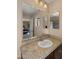 Bathroom features a wide mirror above sink with view to bedroom and a shower with glass doors at 3277 E Meadowview Dr, Gilbert, AZ 85298