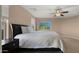 Bright, well-lit bedroom with large bed, neutral walls, and view to the outside at 3277 E Meadowview Dr, Gilbert, AZ 85298